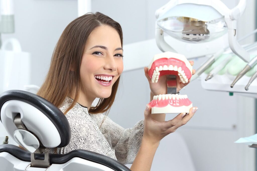 Smiling patient receiving dental implant consultation in Miami